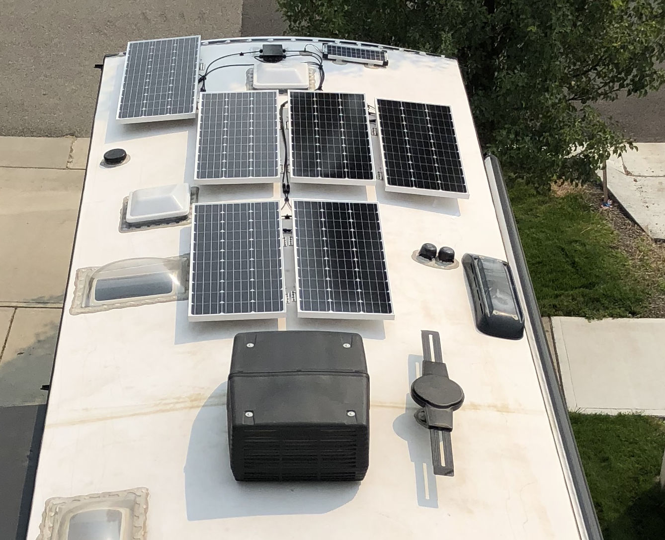 Solar panels mounted on an RV roof with Z-brackets