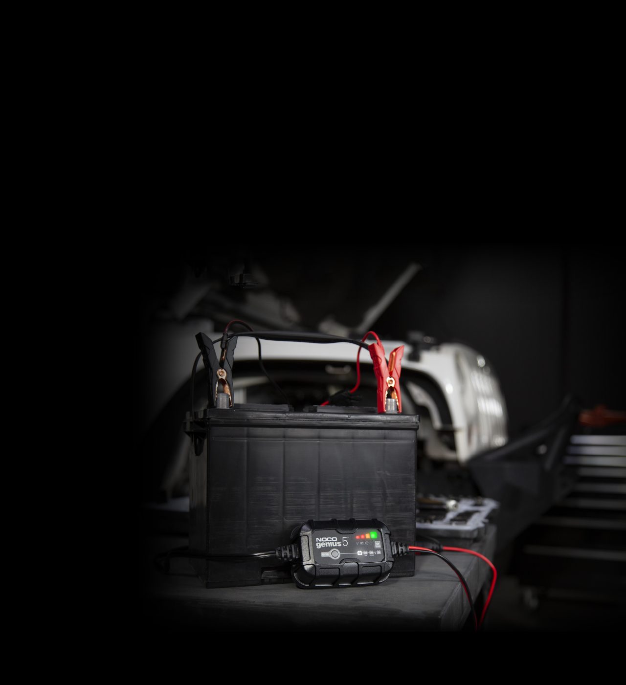 NOCO GENIUS5 smart battery maintainer connected to a 12V battery